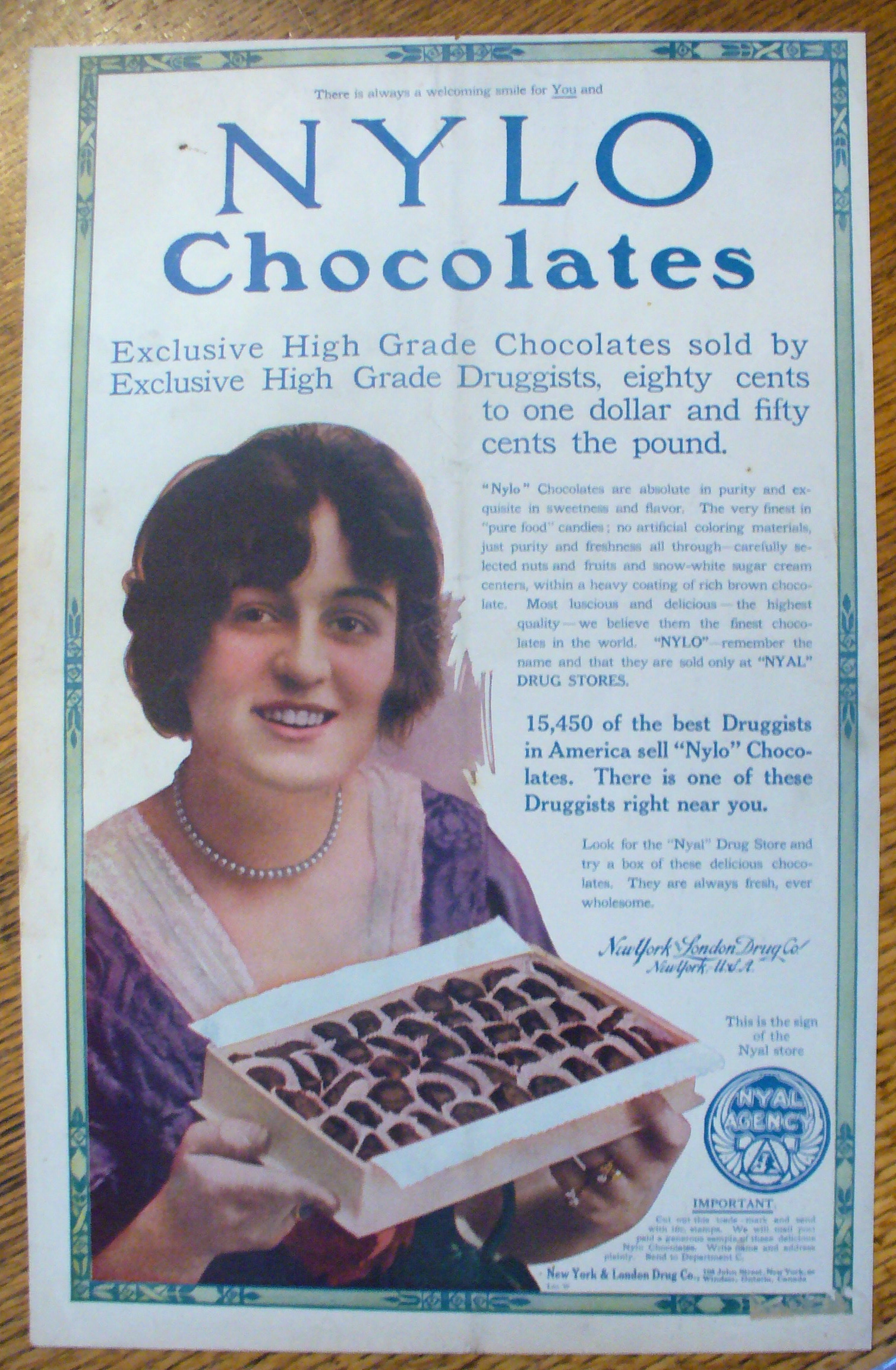 1913 Nylo Chocolates with Woman Holding Box Of Candy