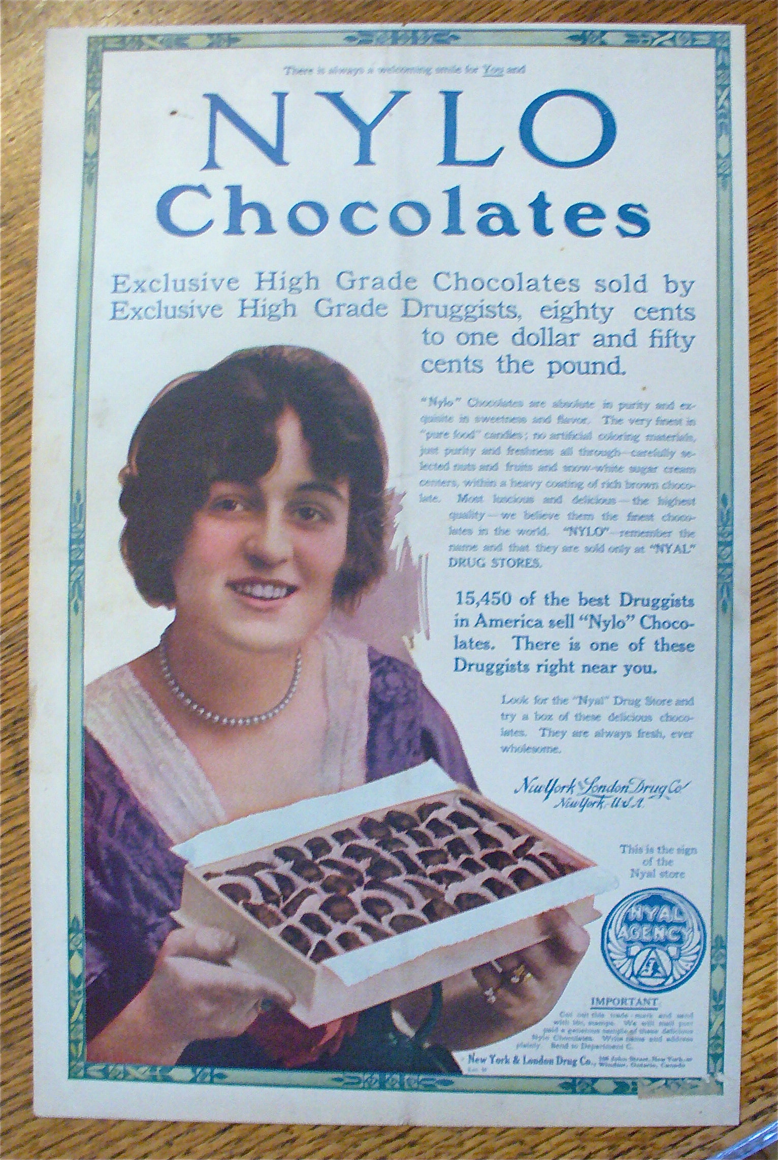 1913 Nylo Chocolates with Woman Holding Box Of Candy