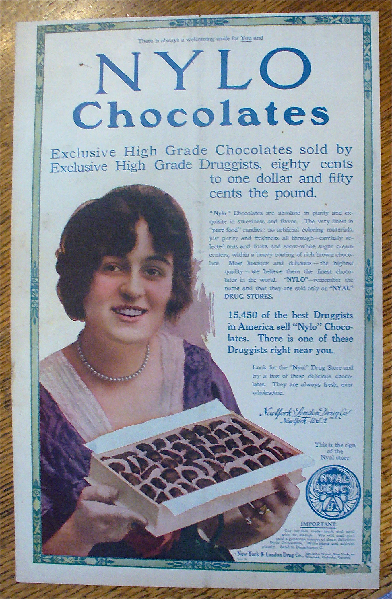 1913 Nylo Chocolates with Woman Holding Box Of Candy