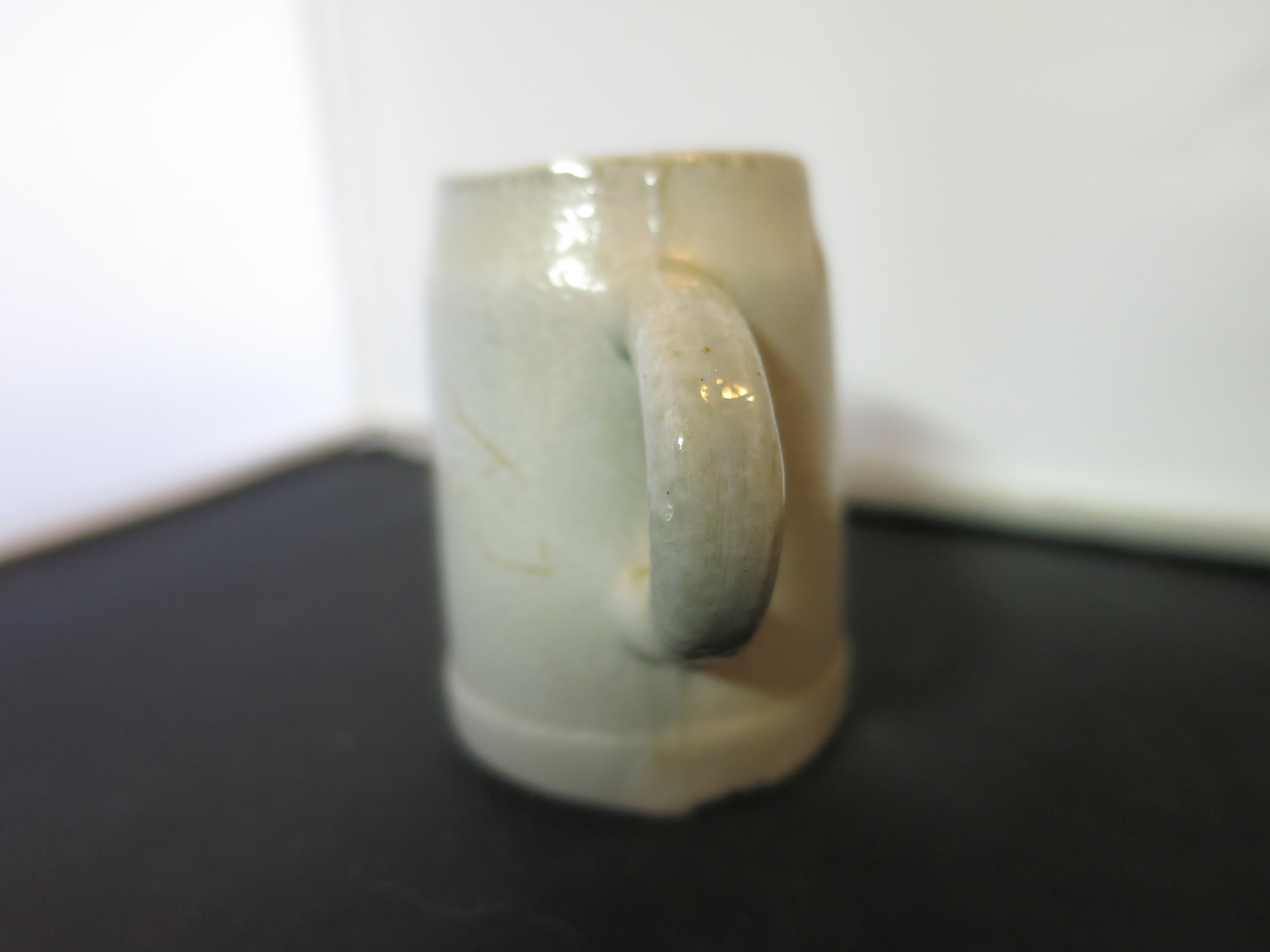 Stoneware Shot Stein with a flow blue motif Height 2 1/8 inches