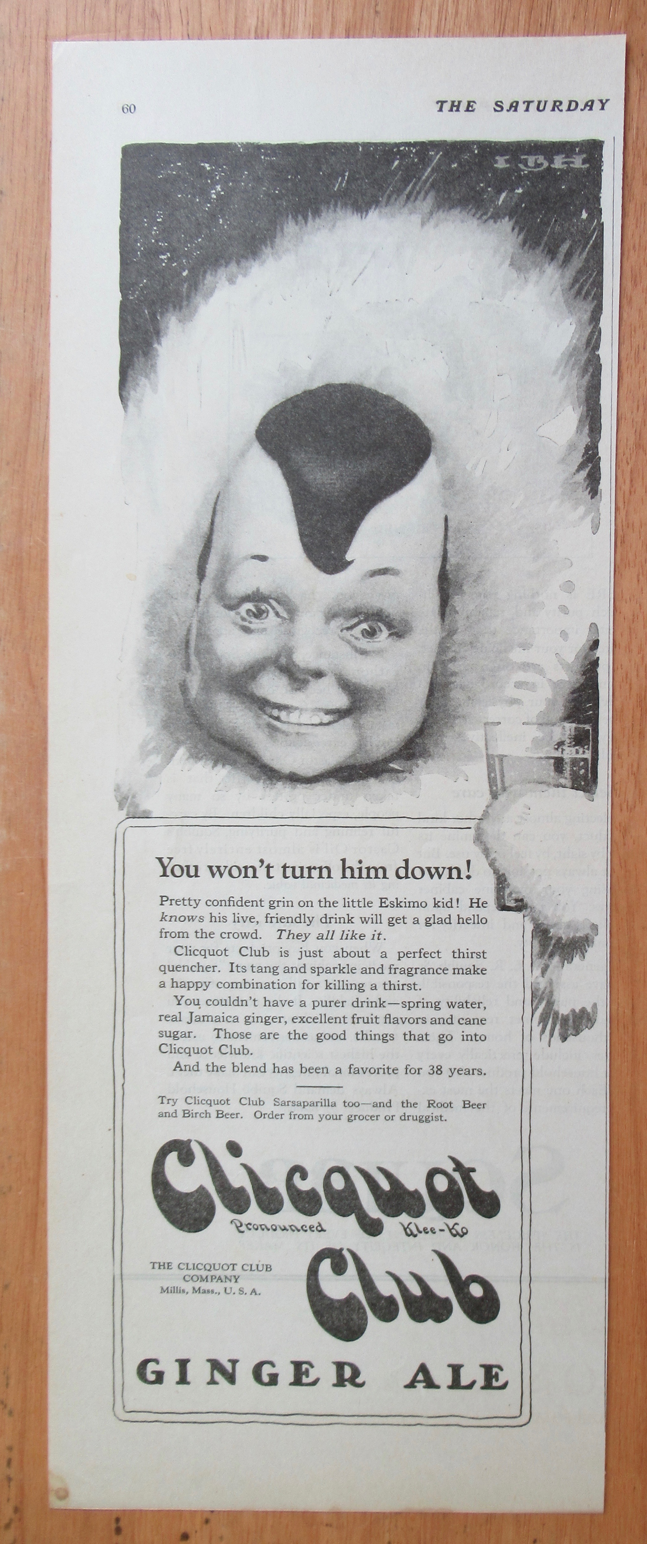 1923 Clicquot Club Ginger Ale with Eskimo Holding Glass