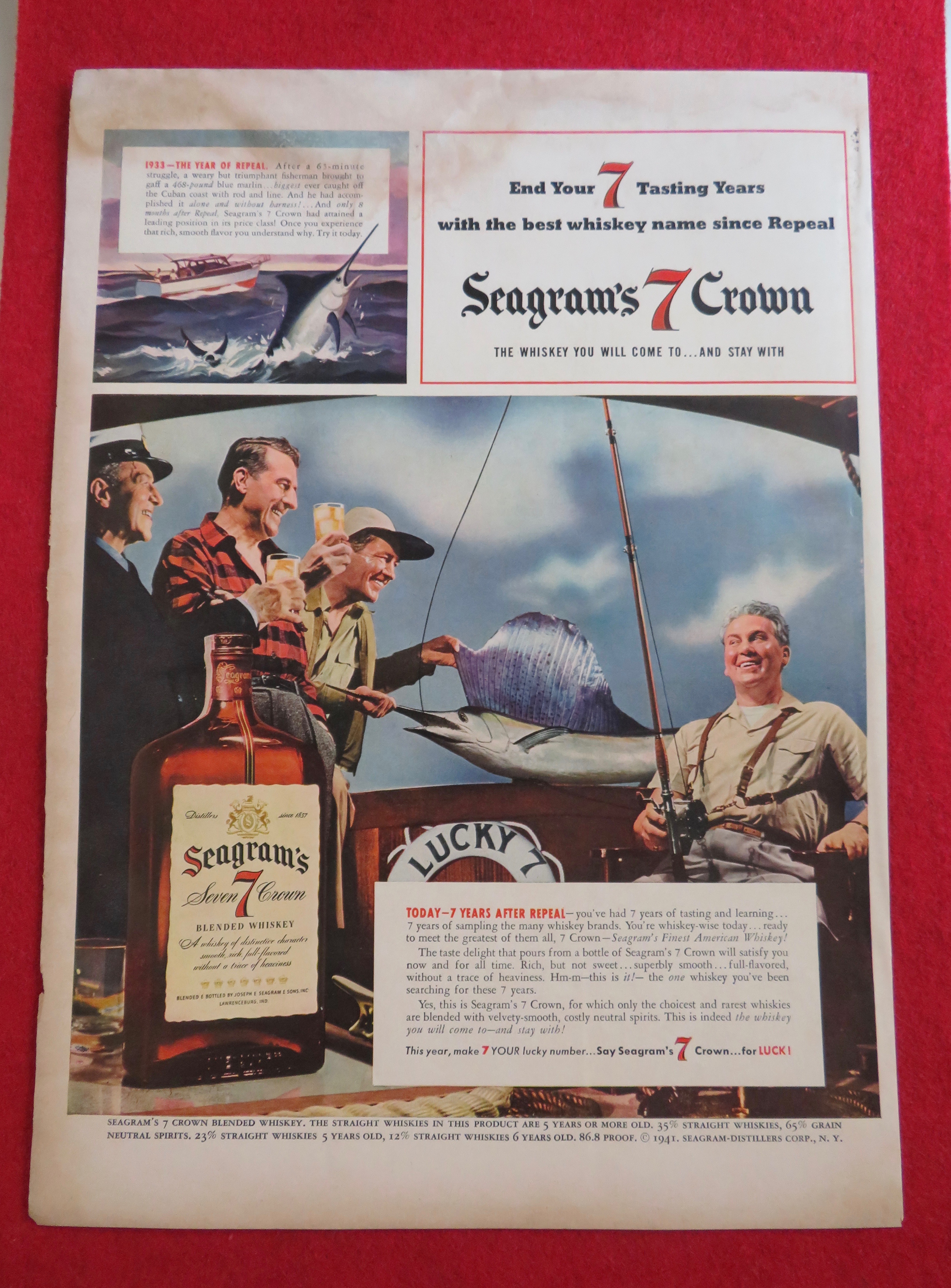 1941 Seagram's 7 Crown with Men Drinking With Big Fish