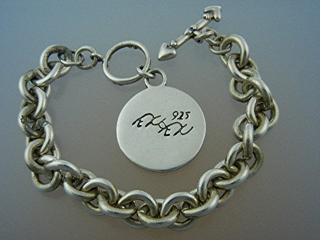 EXEX Sterling Silver Heart Charm Bracelet Claudia Agude