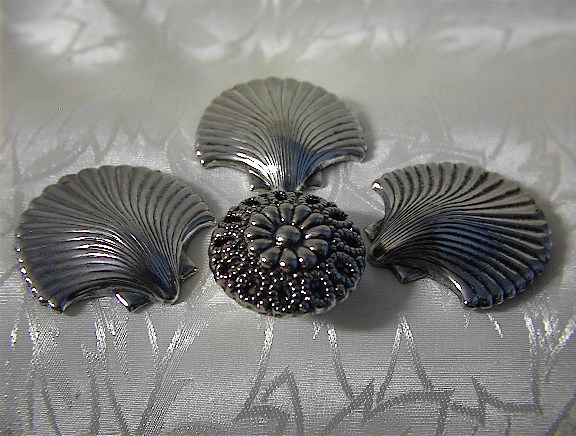 4 Silvertone Shell Button Covers.