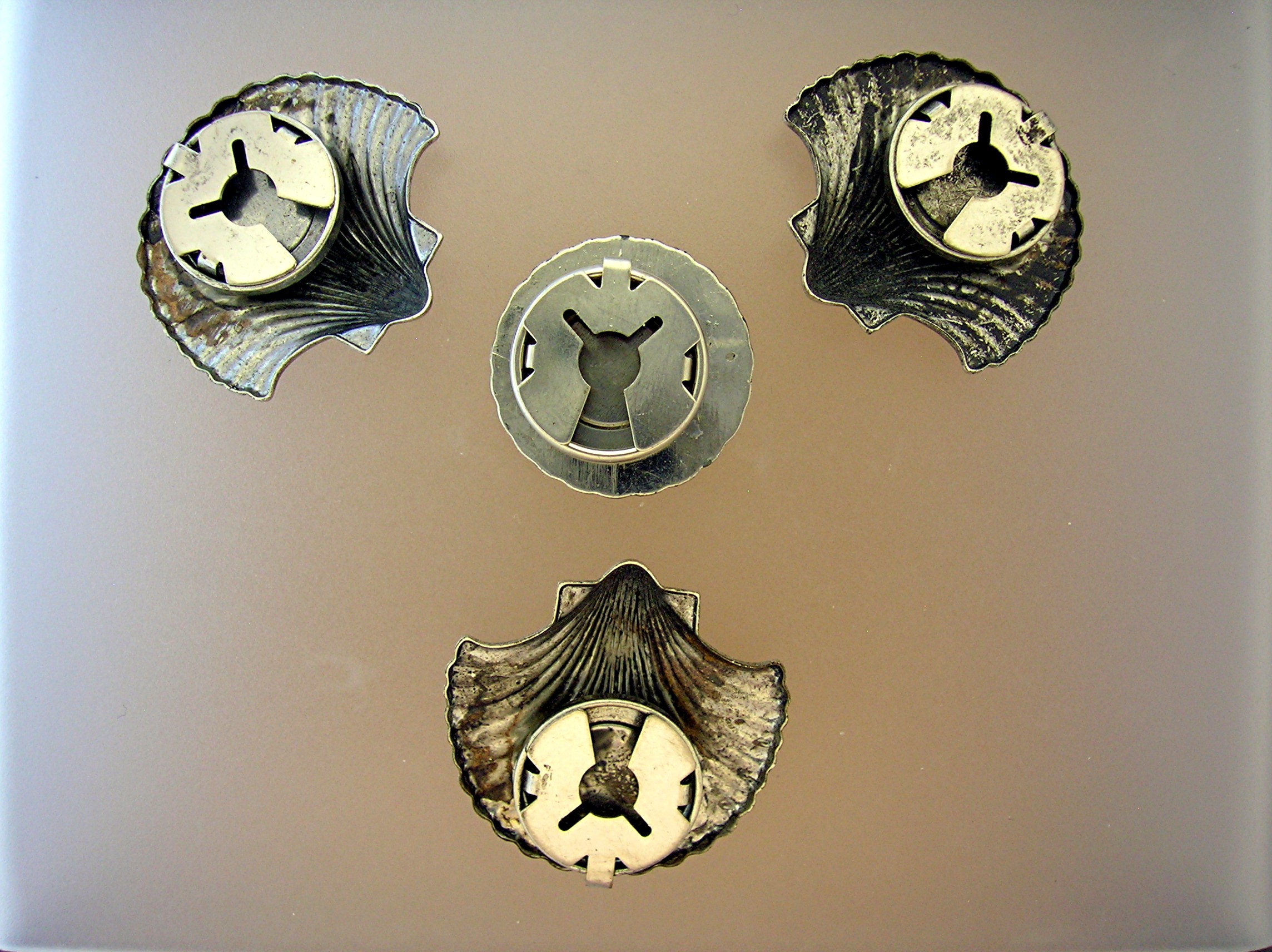 4 Silvertone Shell Button Covers.