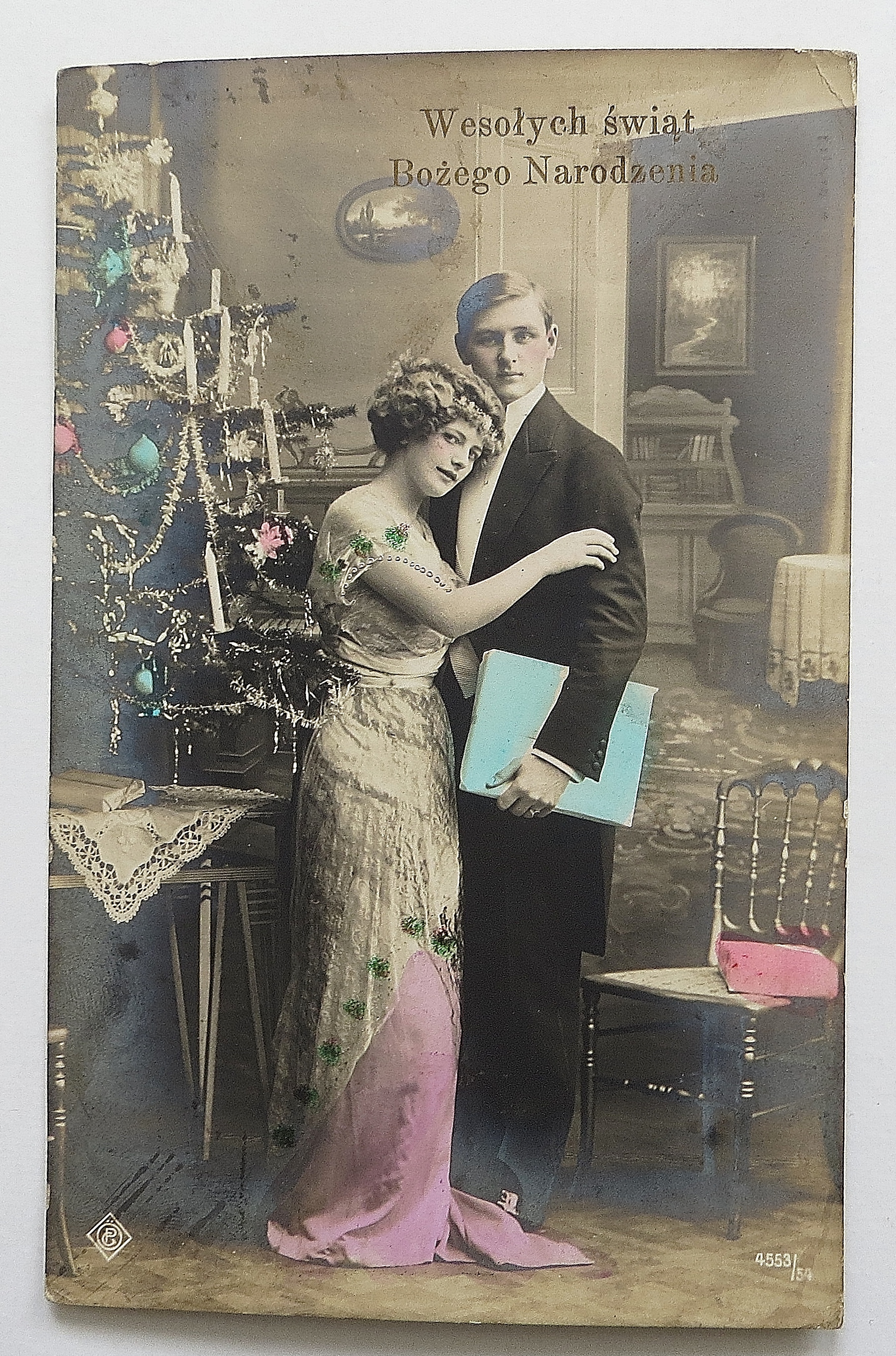Man & Woman Posing By Christmas Tree