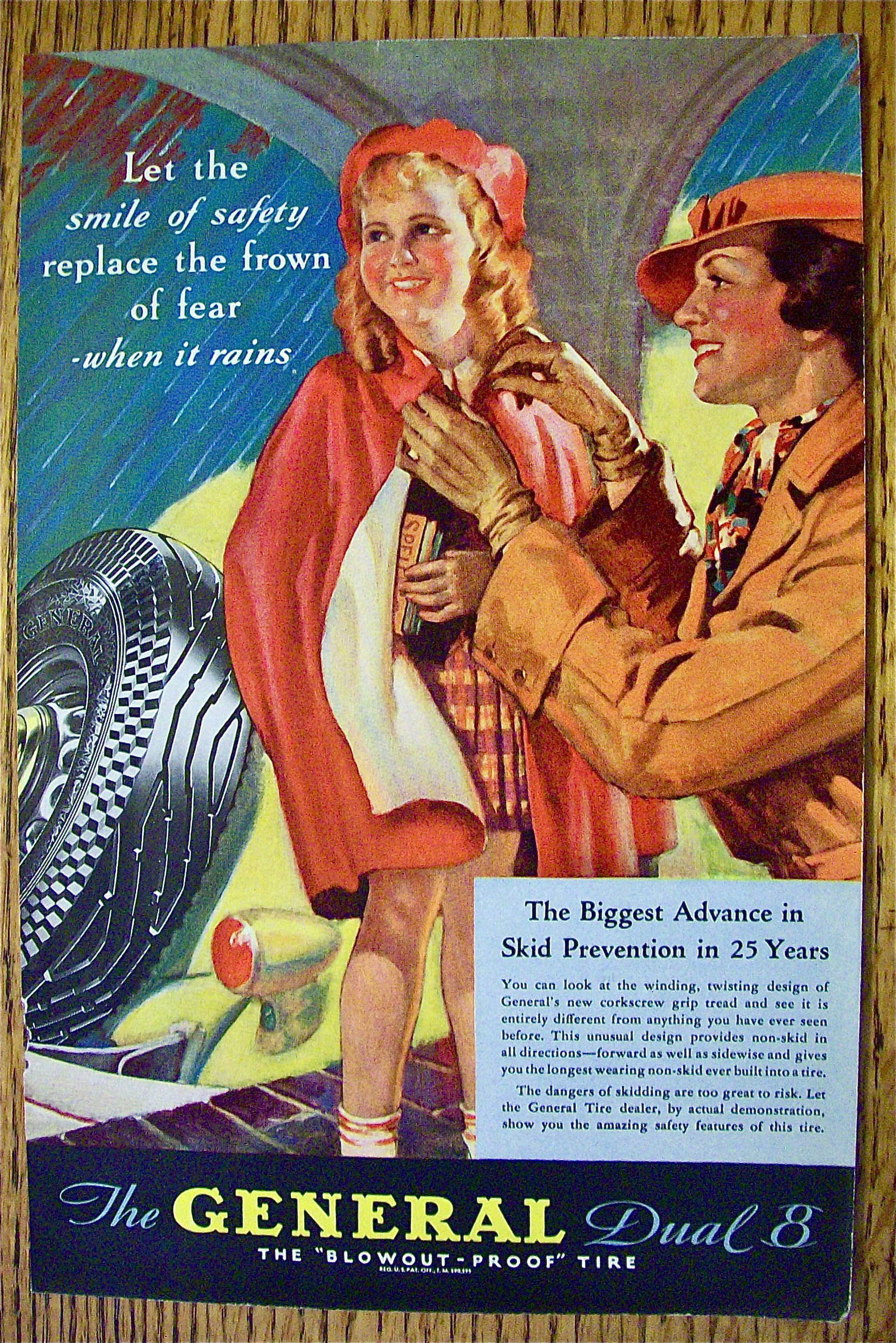 1935 General Tire with Woman Tying Girl's Poncho
