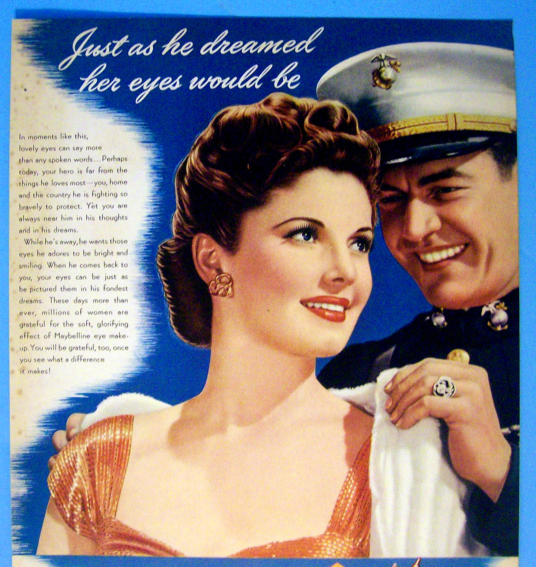 1943 Maybelline w/ a Soldier Putting On A Woman's Coa