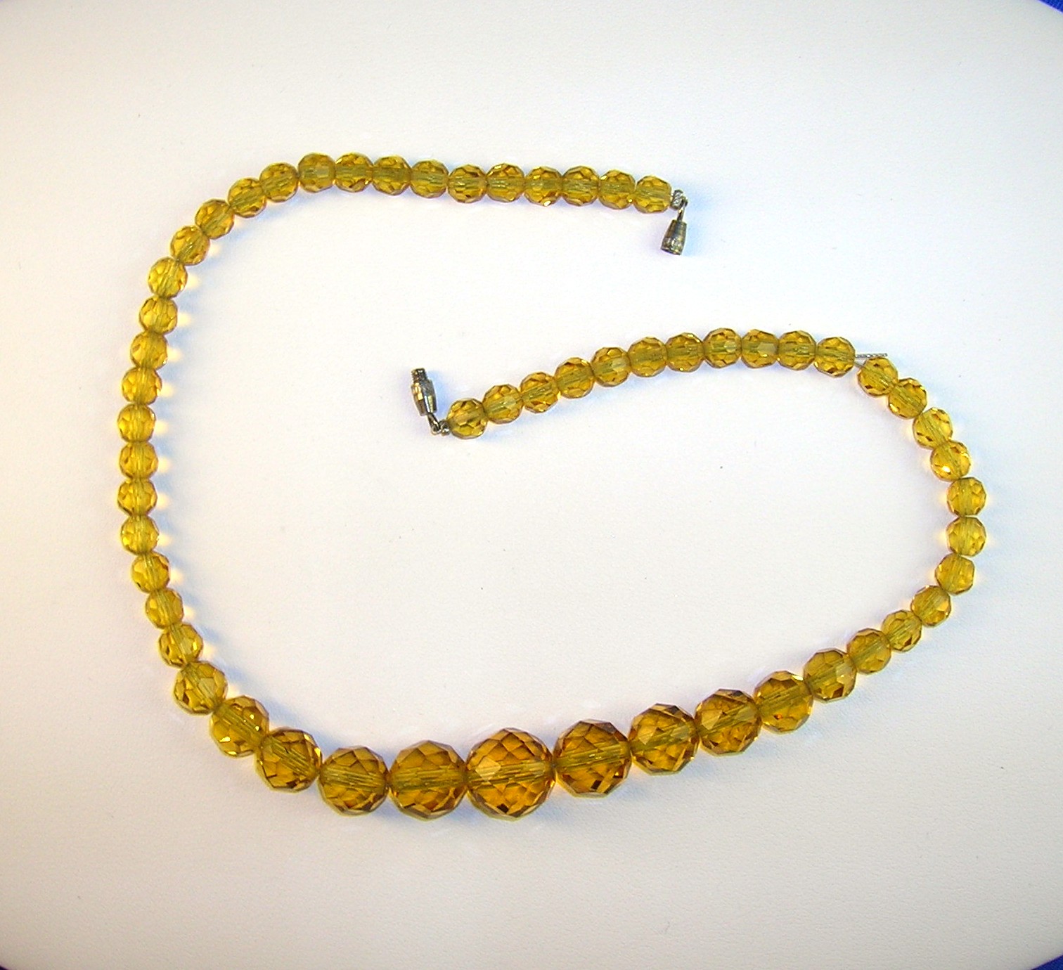 Faceted Graduated Golden Amber Glass Beads