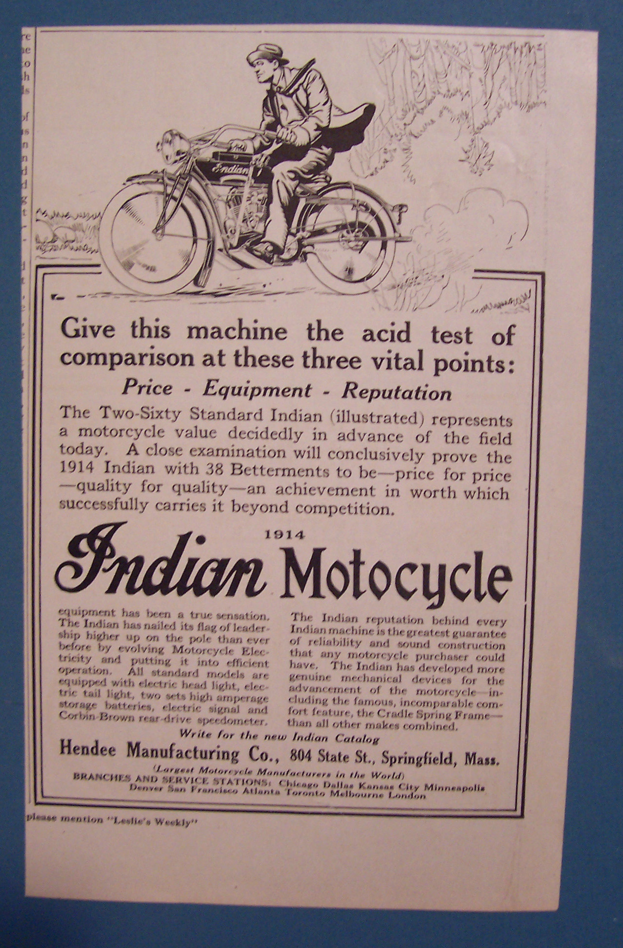 1914 Indian Motorcycle with Man Riding on Motorcycle