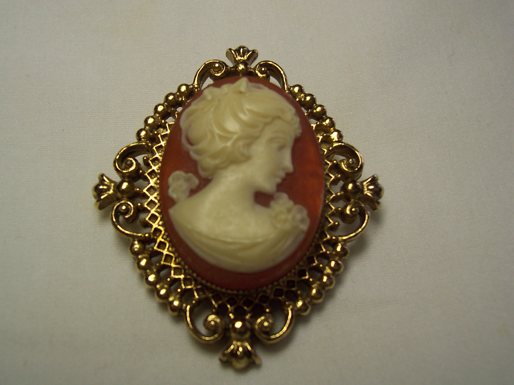 Avon Cameo Locket Perfume Pin Gold Tone