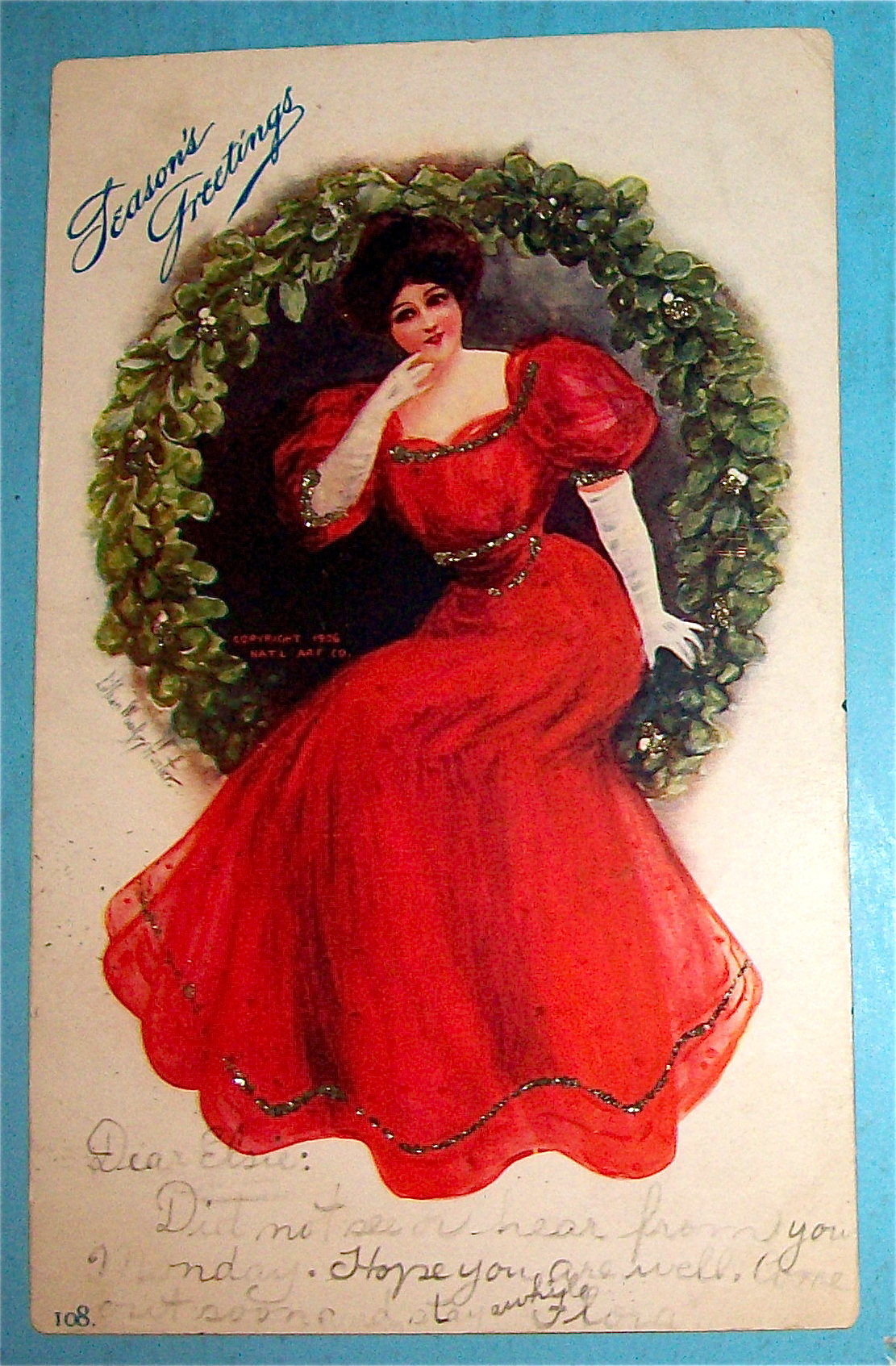 Seasons Greetings With Lady Sitting in Wreath Postcard