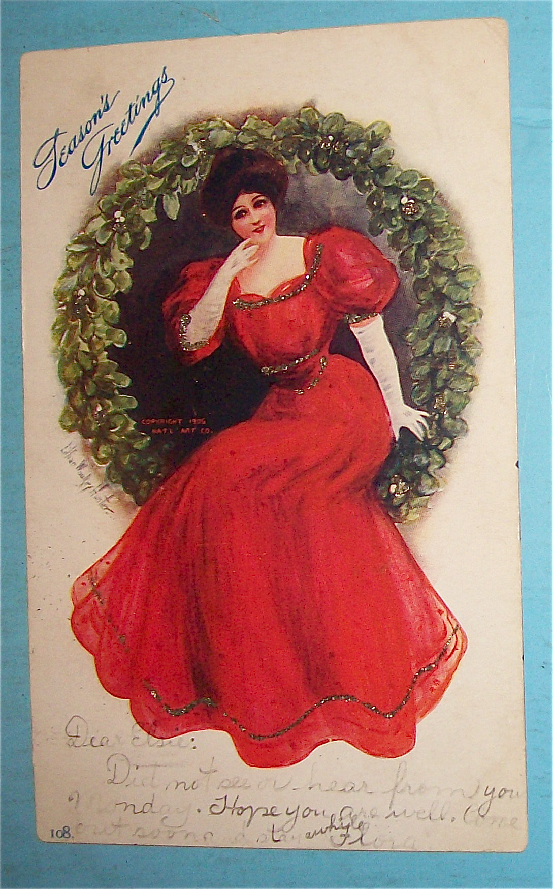 Seasons Greetings With Lady Sitting in Wreath Postcard