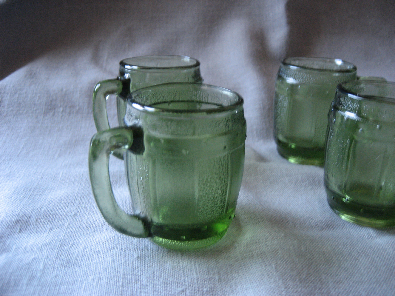 Four Miniature Green Barrel Shot Glass