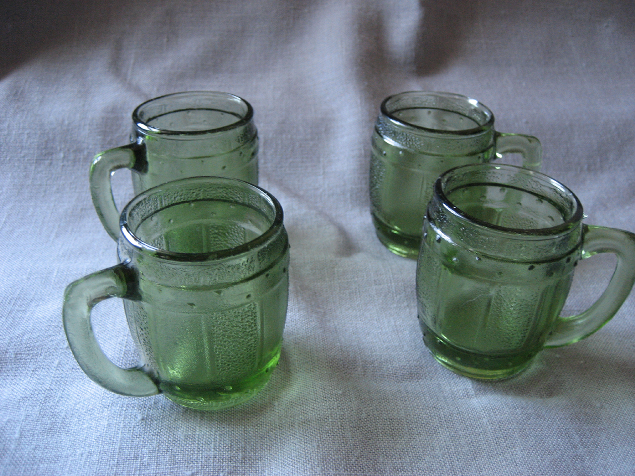 Four Miniature Green Barrel Shot Glass