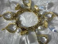 Goldtone Clear Glass & Lucite Charm Bracelet . .