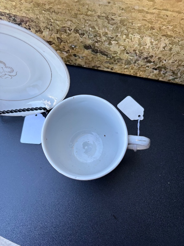 Cloverleaf or tea leaf cup, and saucer made in Japan holds 8 fluid ounces