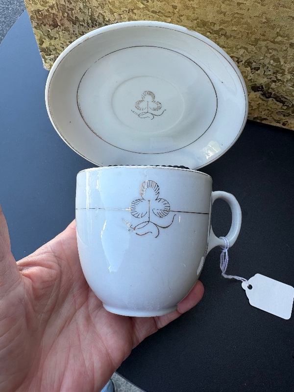 Cloverleaf or tea leaf cup, and saucer made in Japan holds 8 fluid ounces