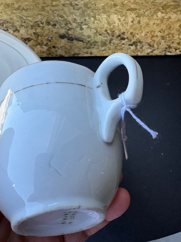 Cloverleaf or tea leaf cup, and saucer made in Japan holds 8 fluid ounces