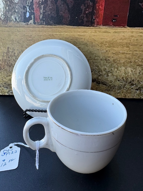 Cloverleaf or tea leaf cup, and saucer made in Japan holds 8 fluid ounces