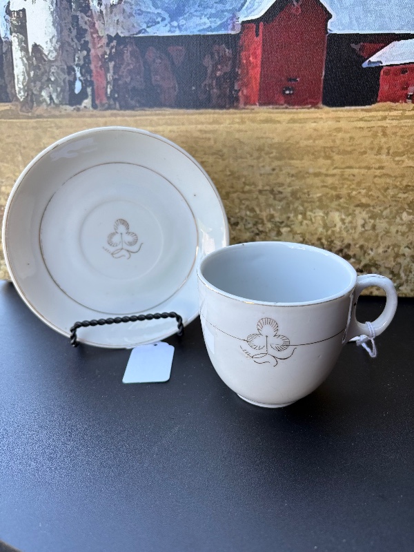 Cloverleaf or tea leaf cup, and saucer made in Japan holds 8 fluid ounces