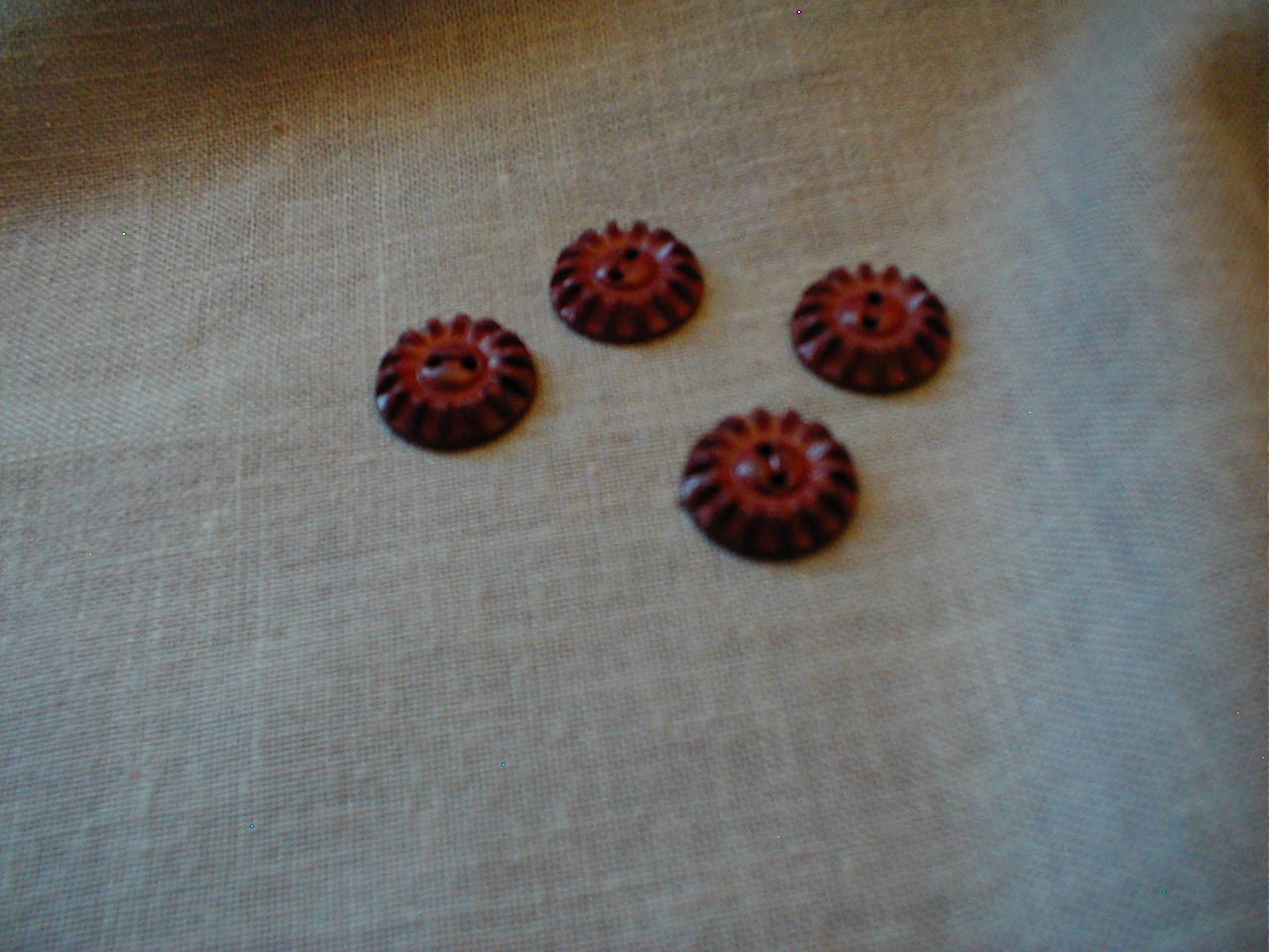 Four Bakelite Buttons