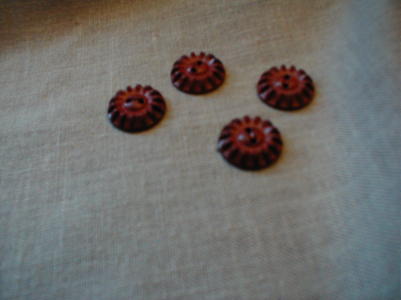 Four Bakelite Buttons