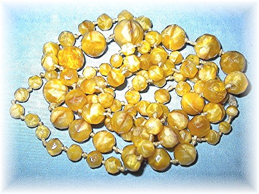 Antique Glass Hand Knotted Butterscotch Glass Beads.