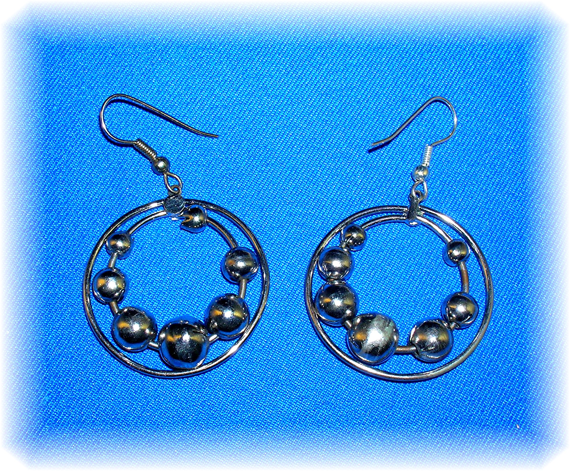 Silver Dangle Earrings Moving Ball Loops