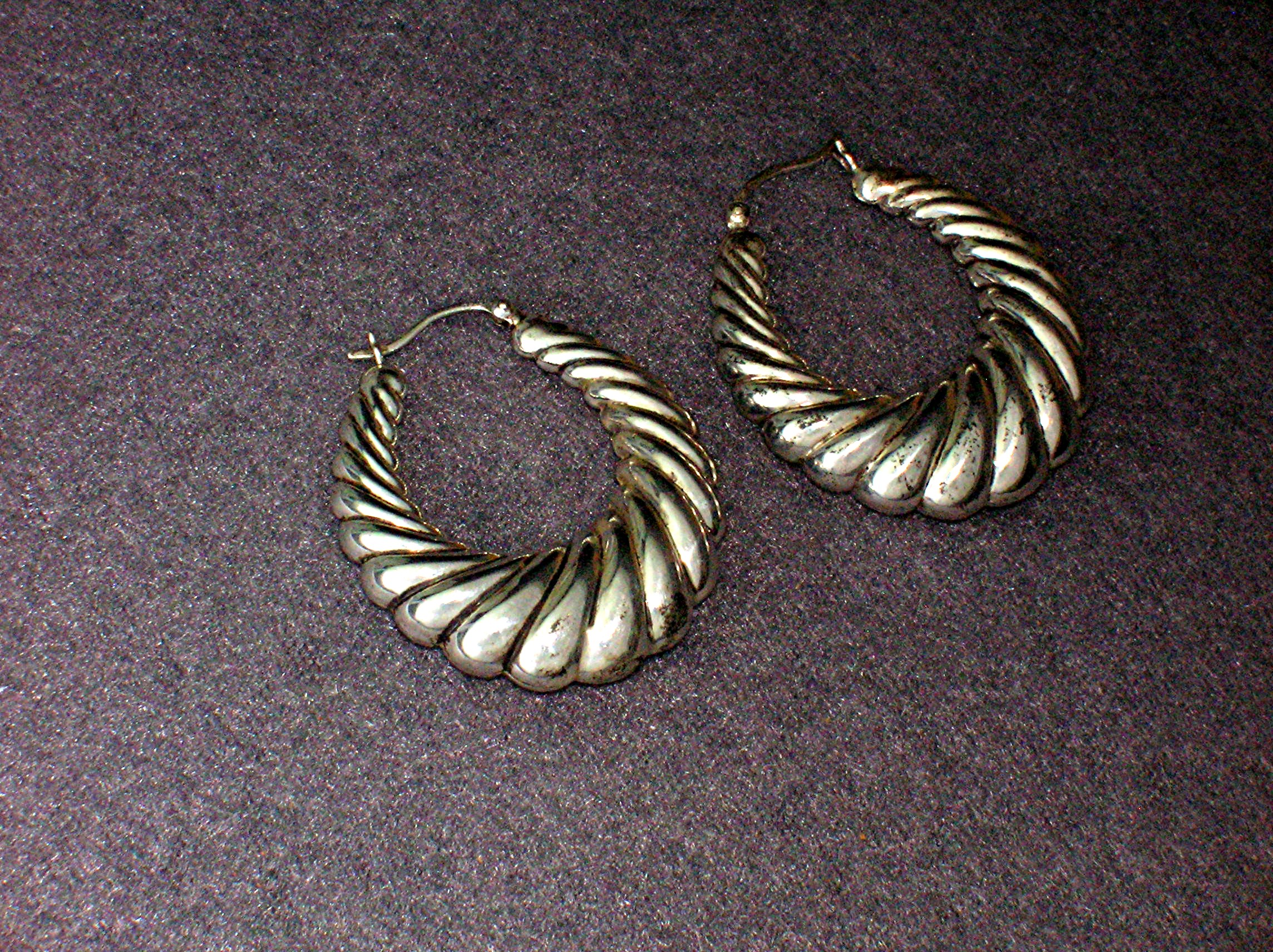 Sterling Silver Pierced Shrimp Style Earrings.