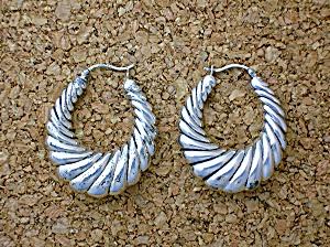 Sterling Silver Pierced Shrimp Style Earrings.
