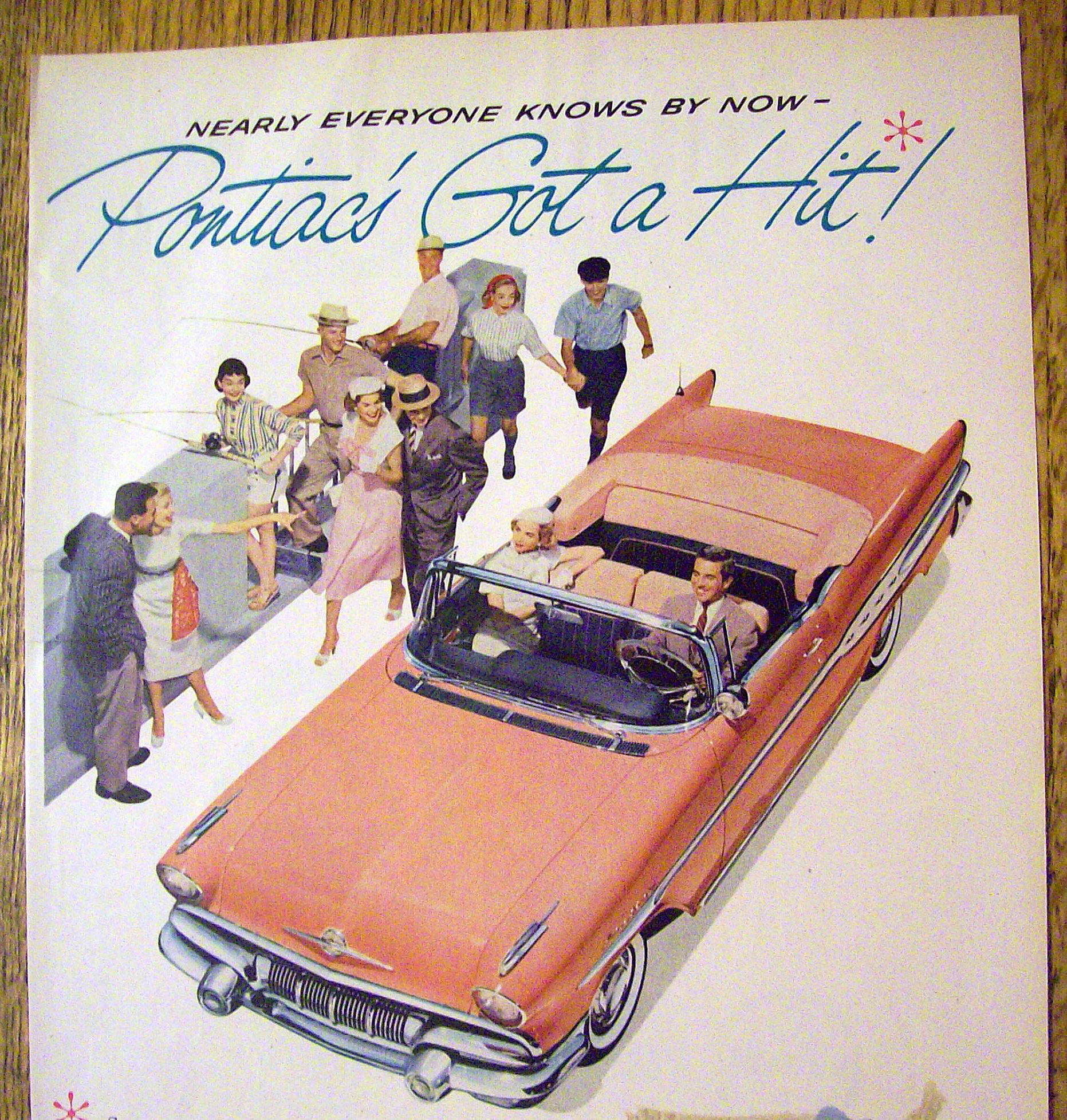 1957 Pontiac with Man & Woman Driving In Pink Pontiac