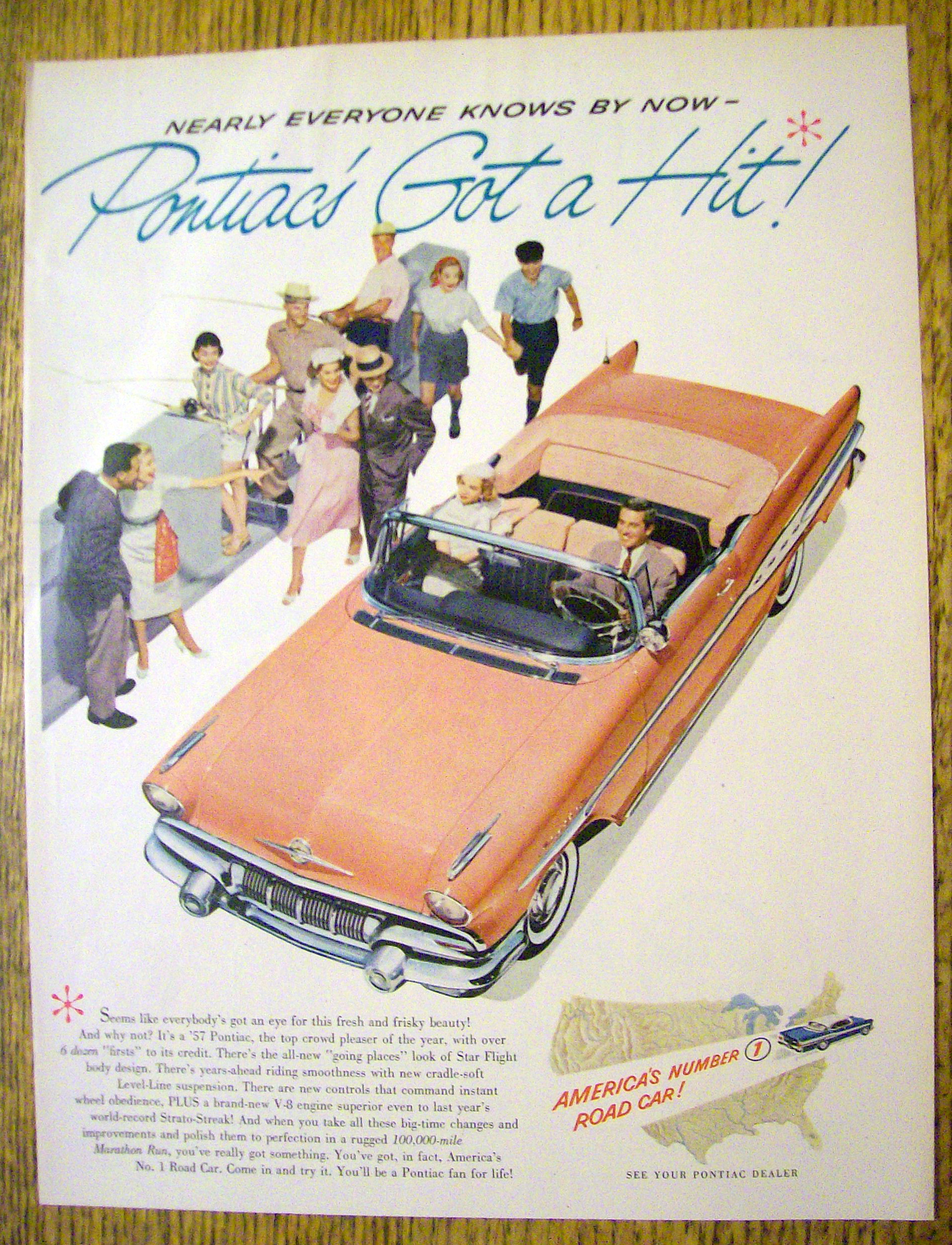 1957 Pontiac with Man & Woman Driving In Pink Pontiac