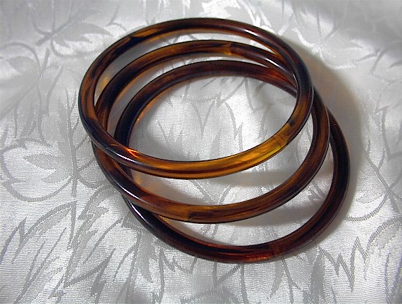 3 Amber Plastic/Lucite Bangle Bracelets.