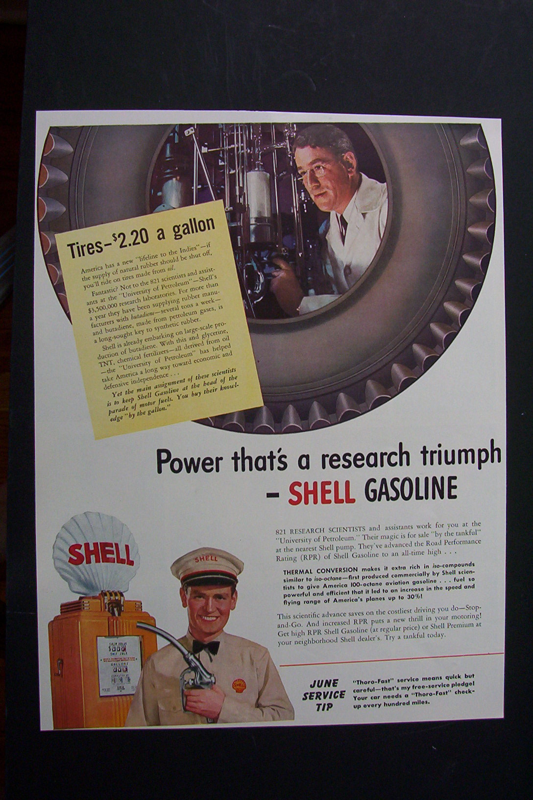 1941 Shell Gasoline with Man Looking Through Tire