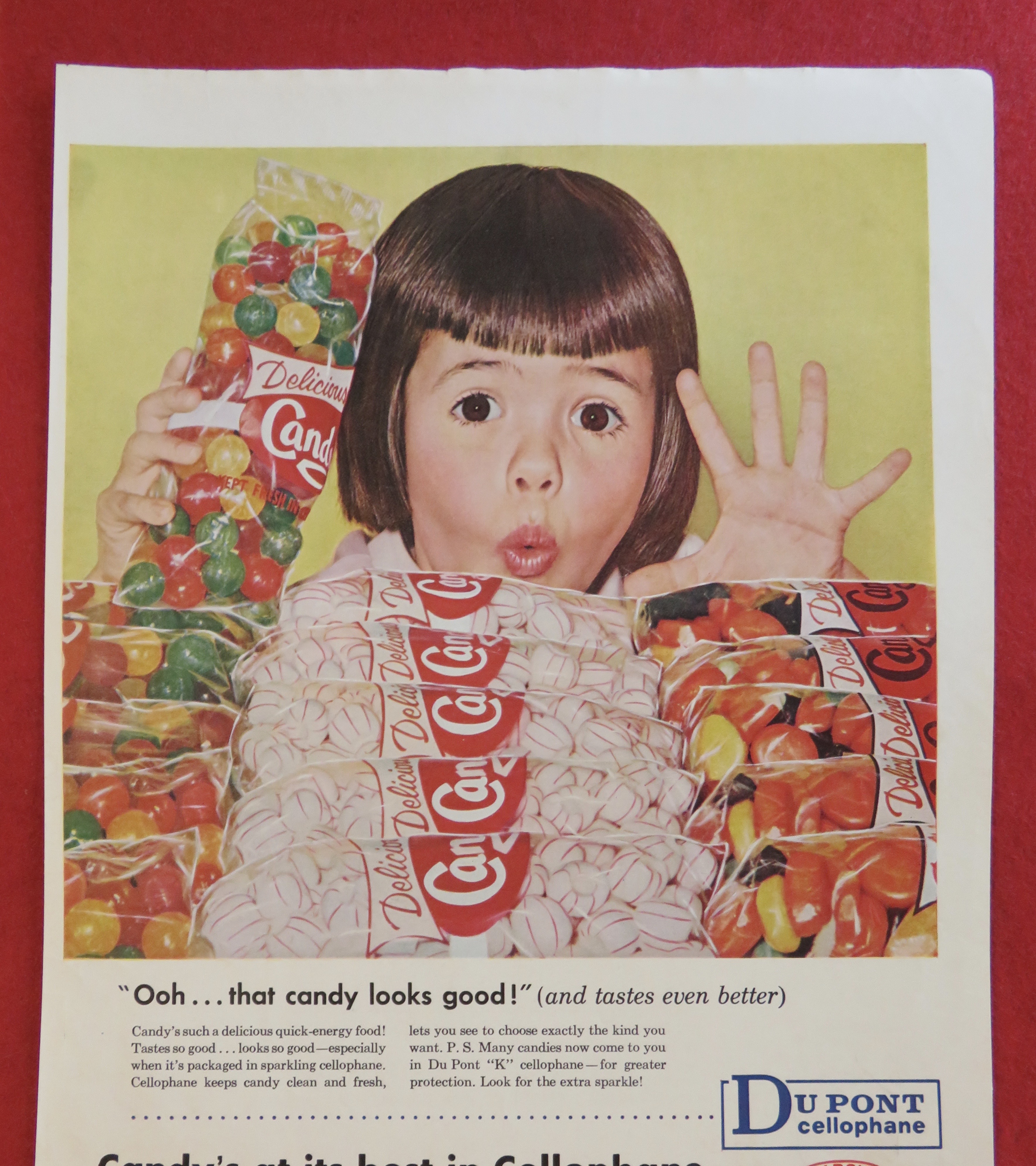 1958 Du Pont Cellophane w/Girl Looking At Bags Of Candy