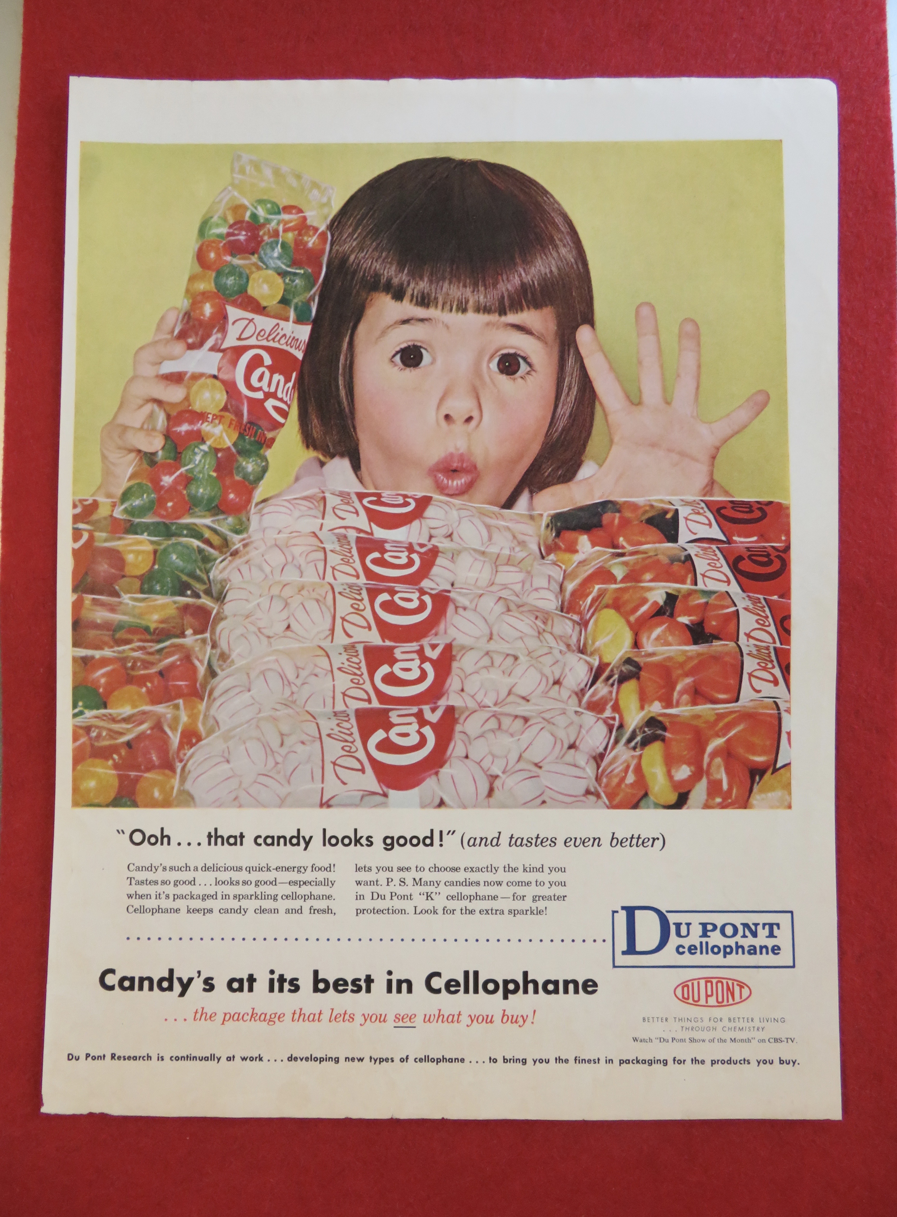 1958 Du Pont Cellophane w/Girl Looking At Bags Of Candy