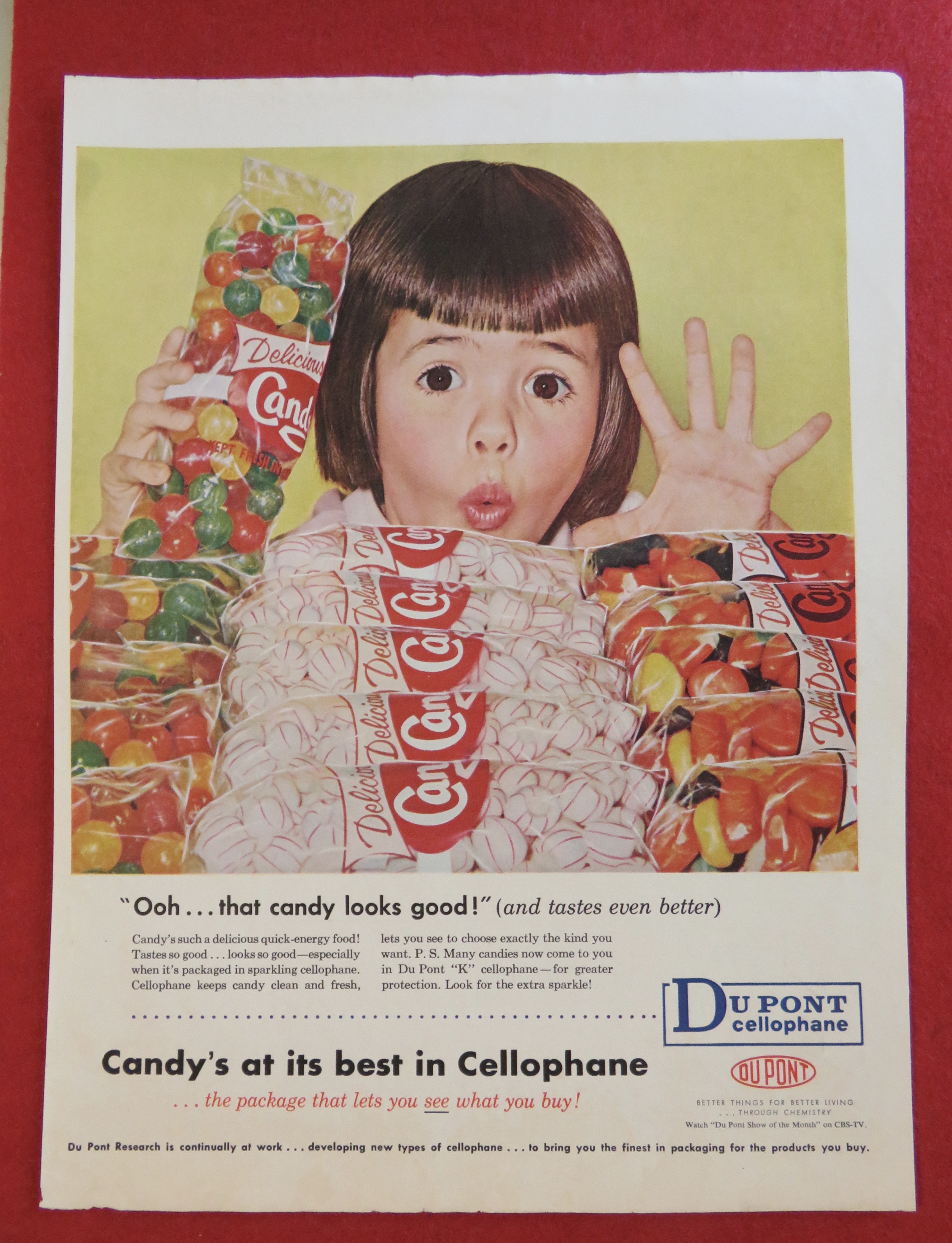1958 Du Pont Cellophane w/Girl Looking At Bags Of Candy