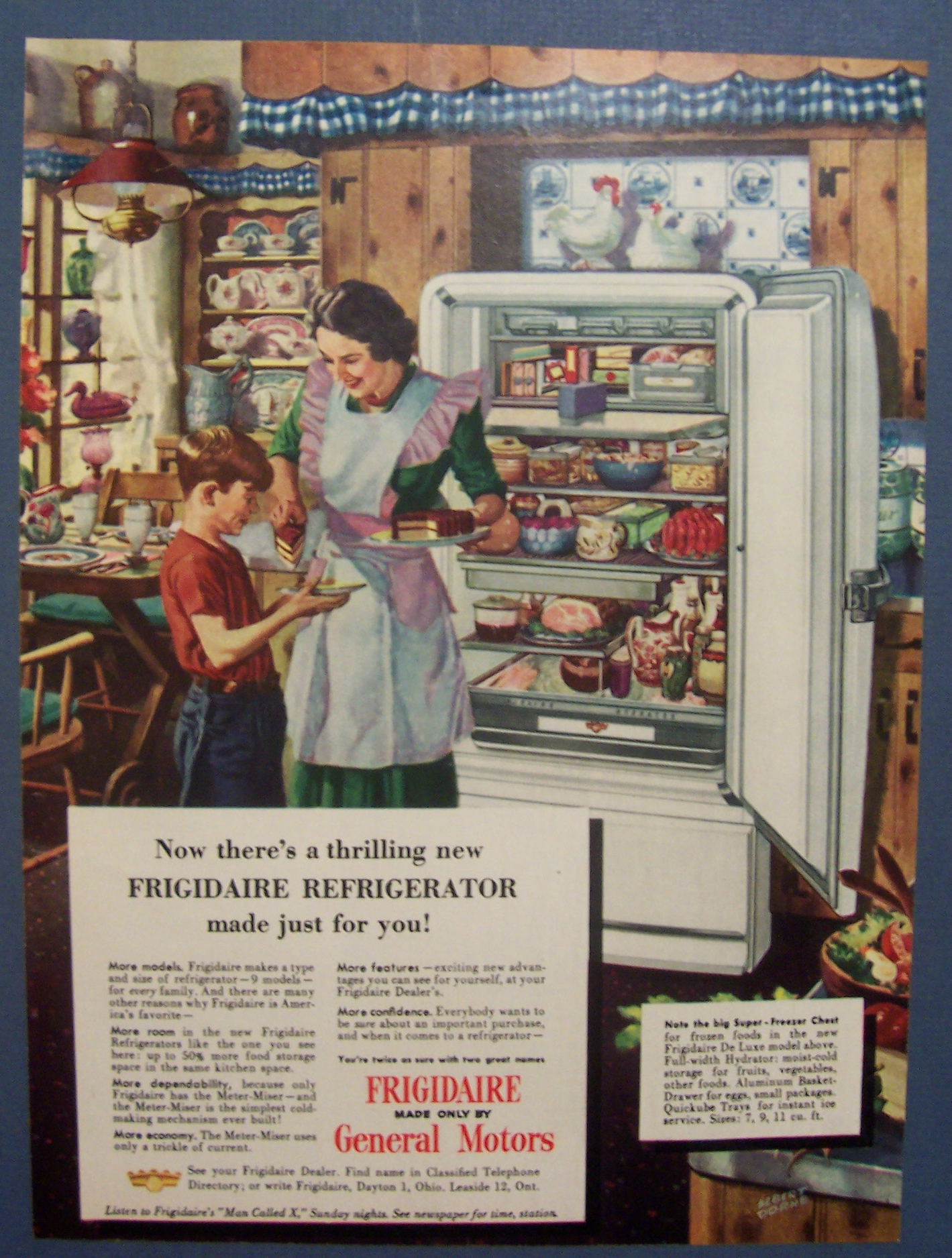 1948 Frigidaire Refrigerator with Woman Giving Boy Cake