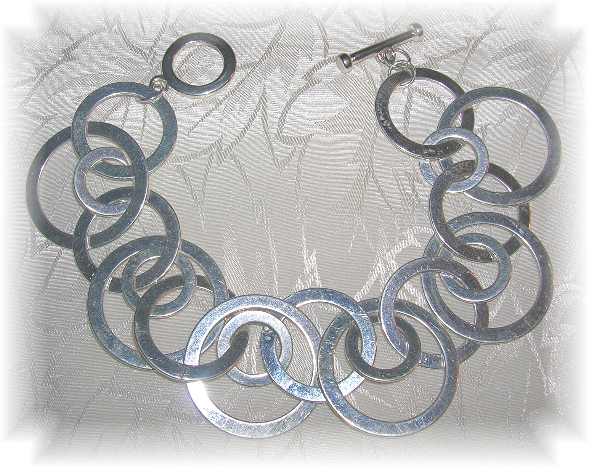 Silvertone Fashion Bracelet - Unique.....