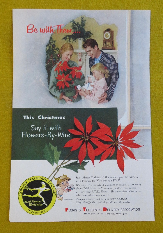 1953 Florists' Telegraph Delivery (FTD) with Woman Holding A Bouquet Of Poinsettias