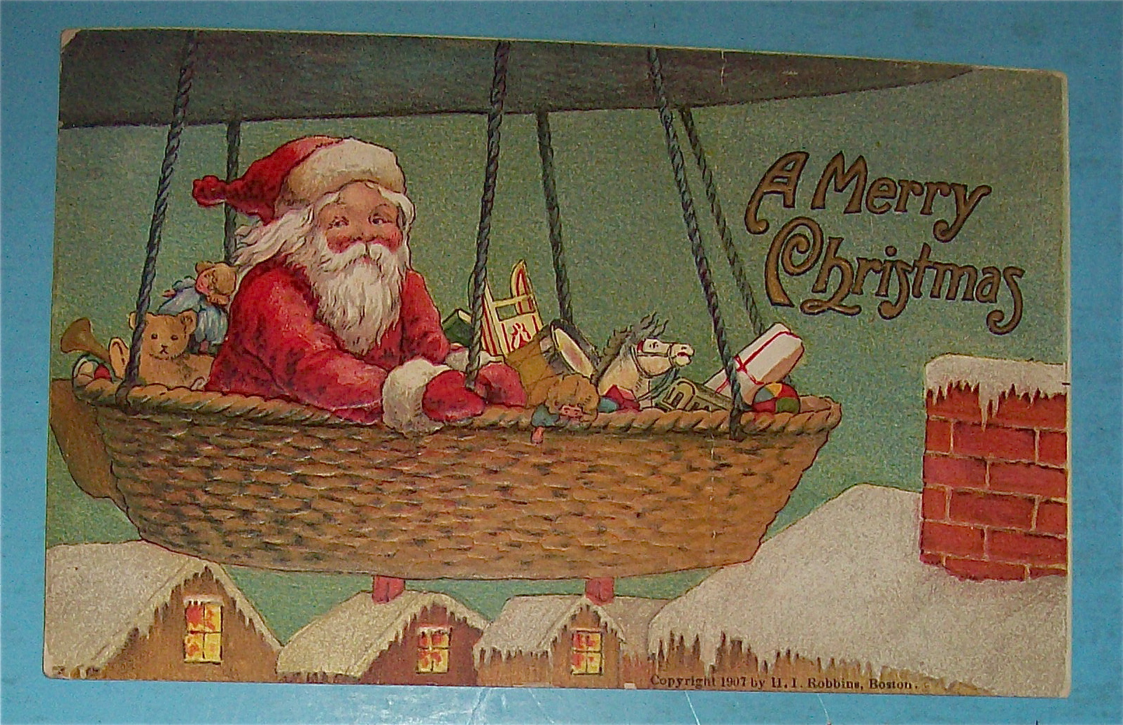1907 A Merry Christmas Postcard with Santa In Balloon