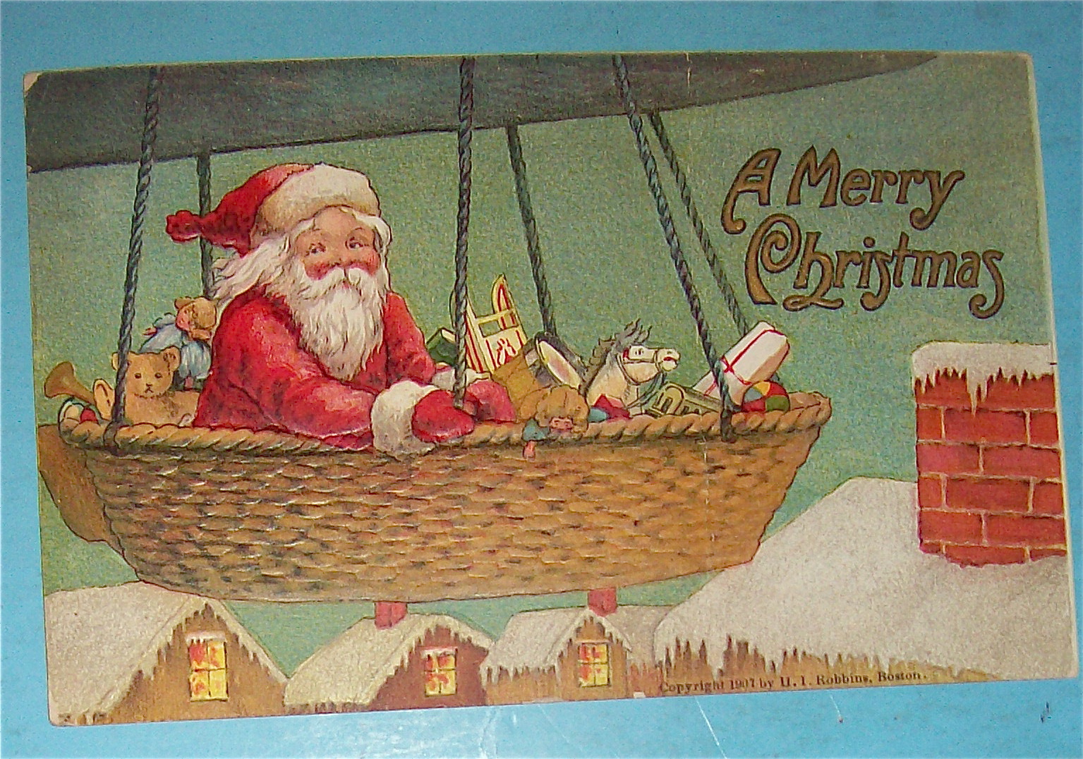 1907 A Merry Christmas Postcard with Santa In Balloon