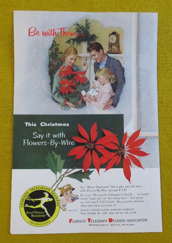 1953 Florists' Telegraph Delivery (FTD) with Woman Holding A Bouquet Of Poinsettias