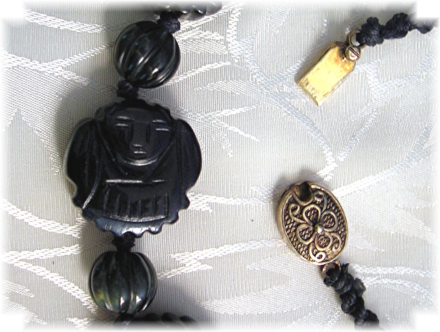 Carved Obsidian Faces 26 Inch Necklace