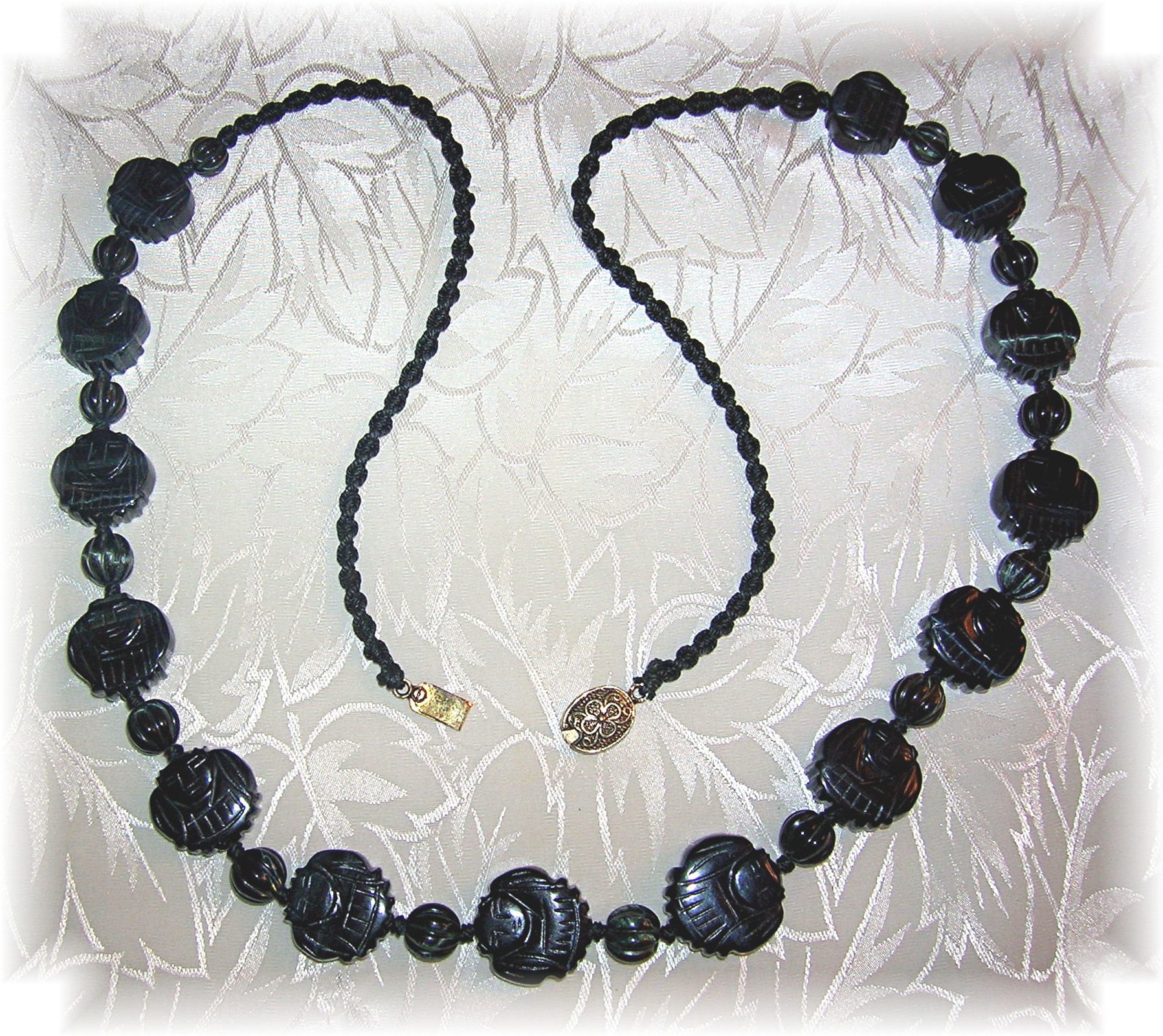 Carved Obsidian Faces 26 Inch Necklace
