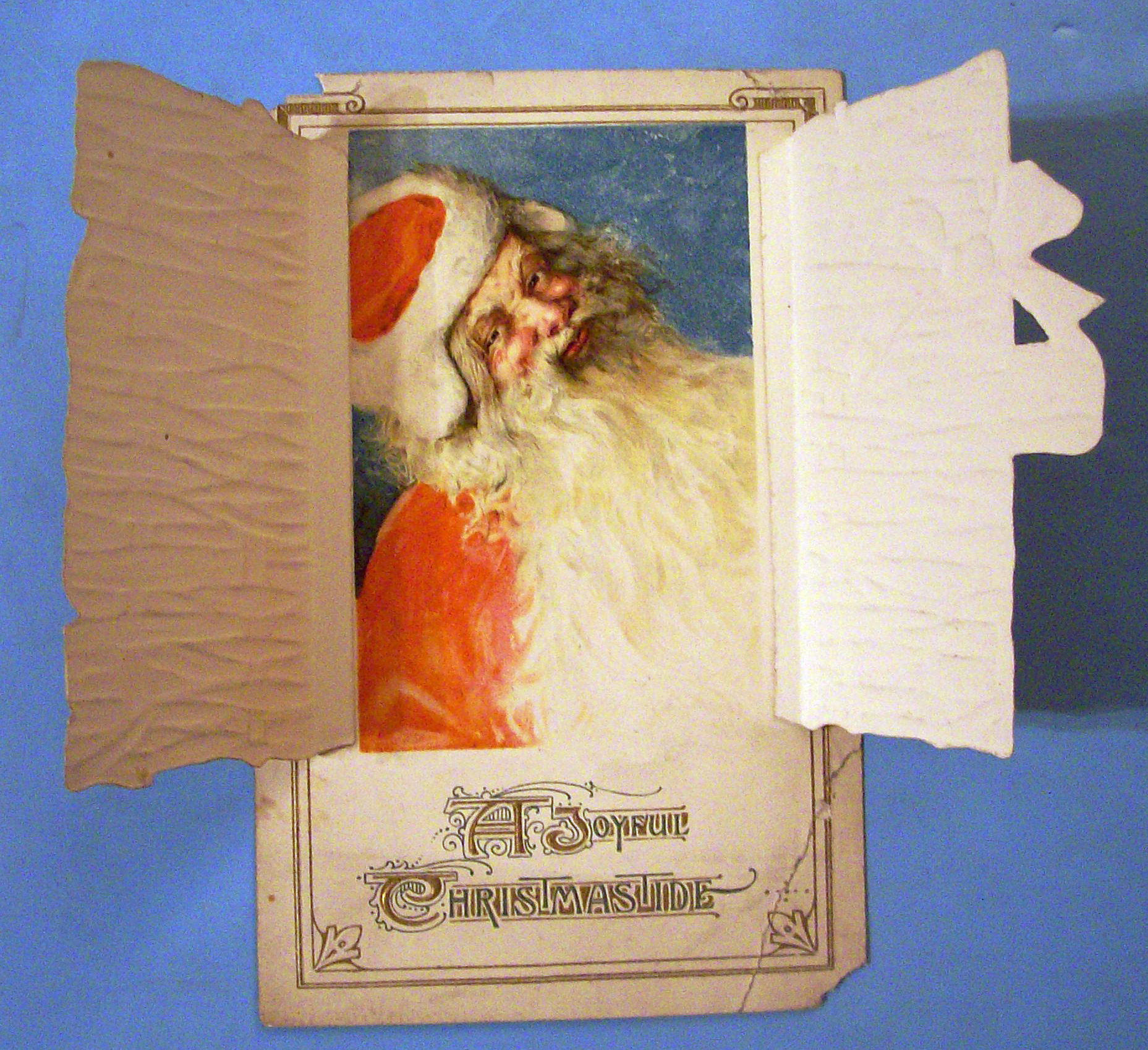 A Joyful Christmas Tide Postcard w/Santa Behind Window