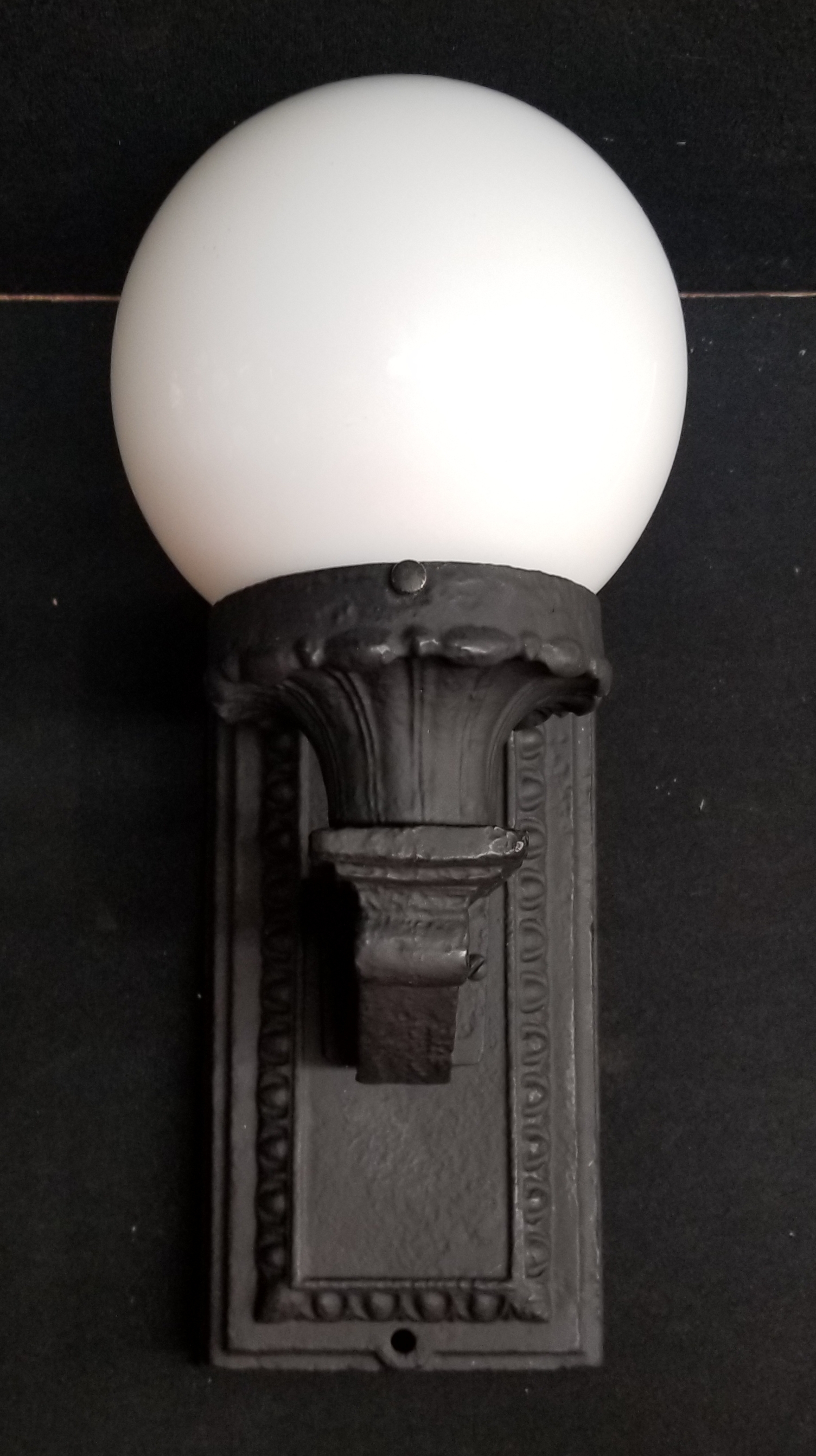 Cast iron wall light...old