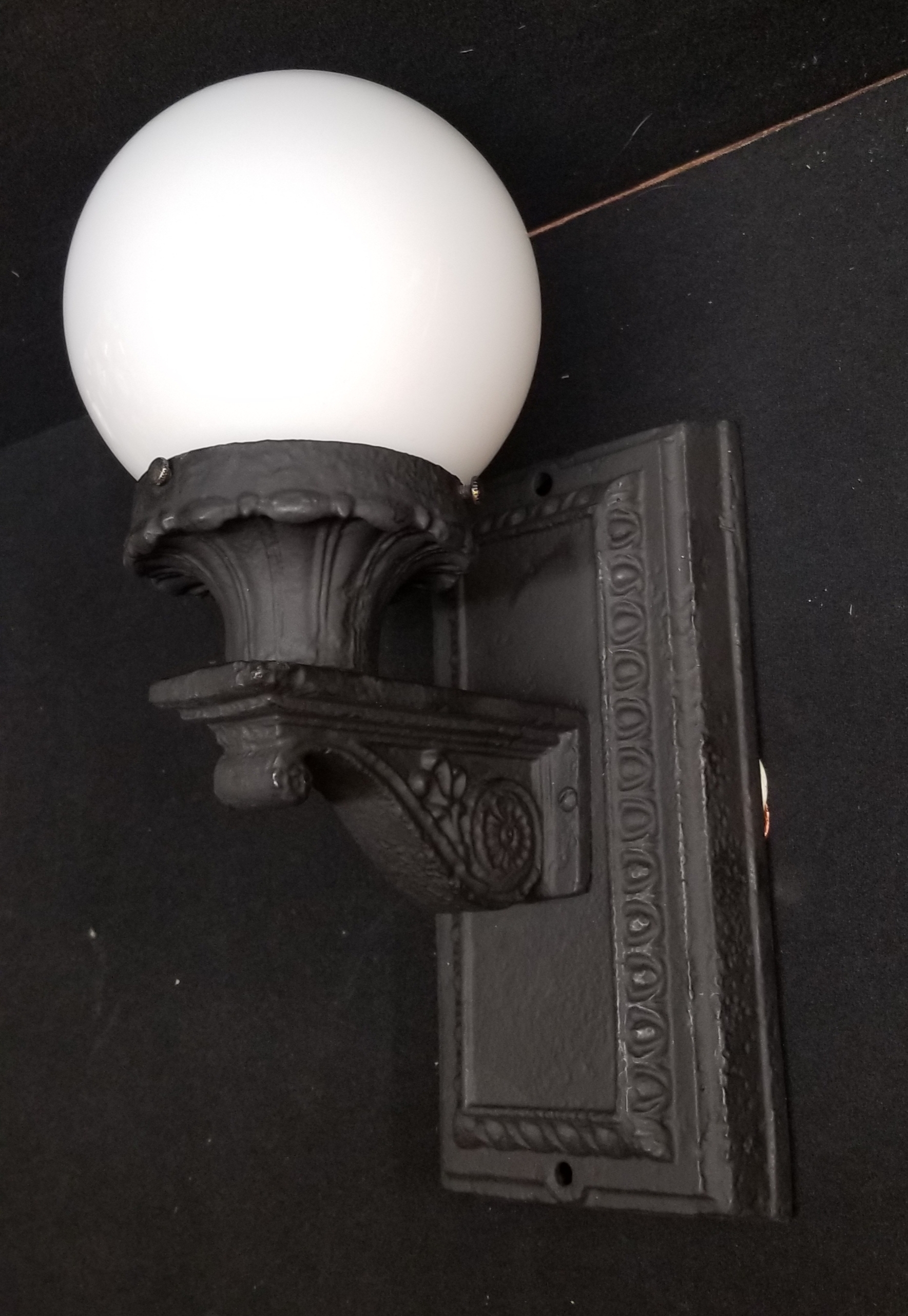 Cast iron wall light...old