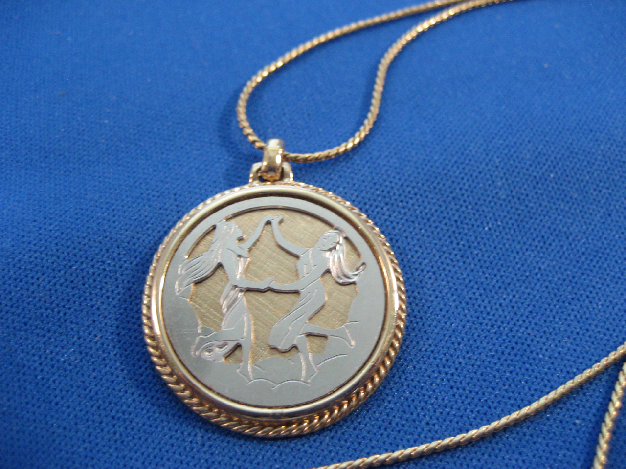 Avon Gold and Silver Genini Necklace